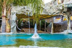 The two main types of swimming pools are either a vinyl liner pool or concrete. How To Design A Fountain Or Waterfall For Your Tropical Pool