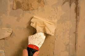 clean wallpaper glue off walls