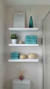Under the sink (in the cabinet) is another place to find great space. These 9 Bathroom Shelf Ideas Will Help You Finally Get Rid Of Unwanted Clutter 3 Shelves Over Toilet Bathroom Shelves Over Toilet Toilet Design