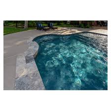 travertine coping and blue surf pebble