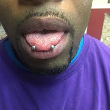 One of the most common symptoms of tongue infection is tenderness as well as swelling of the tongue. The Snake Eyes Piercing The Most Striking Tongue Piercing
