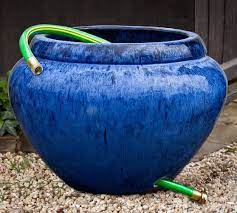 Sedona hose pot with lid, brass accents, holds up to 150 ft. Terra Cotta Garden Hose Pot Blue Pottery Barn