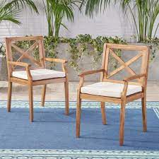 Related images for teak outdoor dining chair. Noble House Perla Teak Brown Cross Back Wood Outdoor Dining Chairs With Cream Cushions 2 Pack 41859 The Home Depot