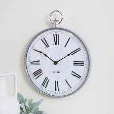 silver metal fob wall clock