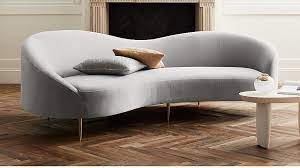 a curved sofa architectural digest