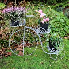 large grey metal tricycle garden plant