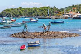 Buzios is famous for its different beaches and vibrant nightlife. Buzios Brazil The Sculpture Three Fishermen Placed In The Bay Of Buzios Photograph By Alejandro Ruhl
