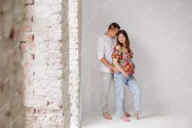 Free Photo | Happy and attractive pregnant couple posing