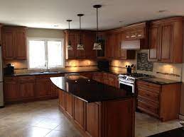 Before selecting granite color, analyze the color of the cherry cabinetry. Cherry Kitchen Cabinets Black Granite In Addition To Cherry Cabinets Maple Wood Doors Black Granite Black Granite Countertops Kitchen Floor Tile Kitchen Design