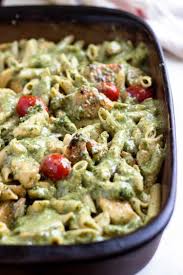tender browned en smothered in a creamy pesto sauce with pasta and tomatoes a
