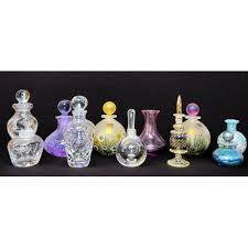 A Collection Of Eleven Perfume Bottles