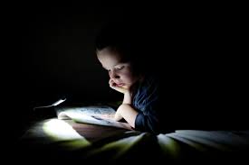 Free Stock Photo Of Boy Reading Books In Bed By Book Light In A Dark Room Reshot