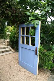 Old doors are just one of my favorite items to use for upcycled and repurposed projects. Artful Salvage Old Doors Decorate The Garden
