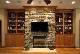 bookcase flanking stone fireplace