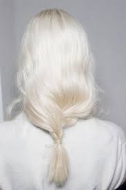 White hair ponytail with black glasses, black top, & classic jewelry. White Hair And A Loose Low Ponytail Long Hair Styles Low Ponytail Hair Makeup