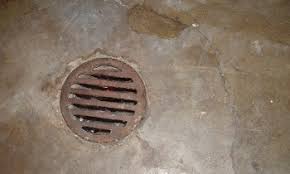 can you cover a basement floor drain