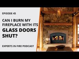 close glass doors on fireplace
