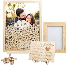 In general, a guest book is paper or electronic means through which visitors acknowledge a visit to places such as weddings, functions or websites. Amazon Com Ourwarm Wedding Guest Book Alternative Wooden Picture Frame With 80 Blank Hearts Drop Top Frame Guest Book For Rustic Wedding Anniversary Graduation Baby Shower Home Decorations Display Easel Home Kitchen