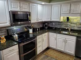 Scrub the inside and outside of your cabinets with a clean cloth or sponge dipped in a solution of equal parts water and vinegar. Get New Kitchen Cabinets Revelare Kitchens