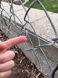 gap at the bottom of a chain link fence