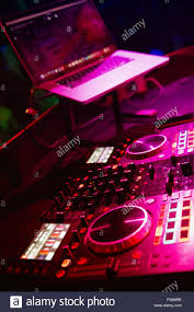 Dj Mixes The Track In The Nightclub At Party Dj Hands In