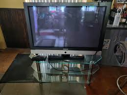 samsung tv on large glass stand and