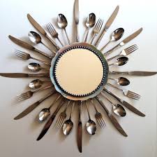A Starburst Mirror With Forks Spoons