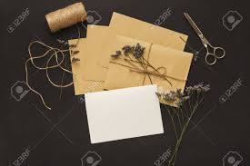 Wedding Invitations And Craft Envelopes On Black Background