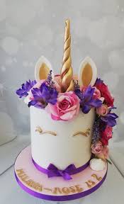 unicorn cake with artificial flowers