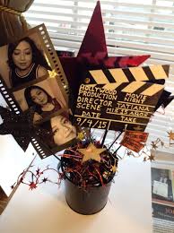 Pull off a fantastic movie party theme with these vintage style movie night printables. Movie Night Hollywood Theme Party Table Centerpiece Decoration Quinceanera Front View Colors Blac Movie Themed Party Hollywood Party Theme Hollywood Theme