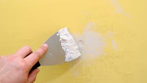 to repair holes in plasterboard walls