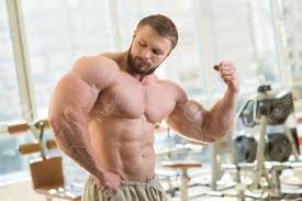 It's called the love handles and then the ceteris switches its muscle. Muscular Man Strong Man Is Looking At His Muscles Muscular Stock Photo Picture And Royalty Free Image Image 50580459