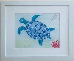 swimming turtle white framed wall art