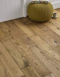 In fact, engineered wood flooring will generally cost you less than solid wood for the same look, because less of the 'species' tree is used to create engineered wood. Loft Natural Oak Brushed Oiled Engineered Wood Flooring Flooring Superstore