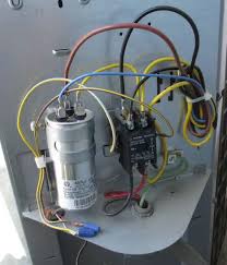 what is an ac capacitor heating