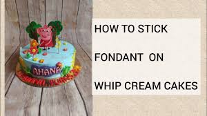 how to stick fondant on cream cakes