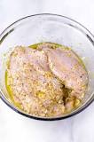 What does putting lemon on raw chicken do?