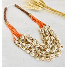 orange sustainable beads with cowrie