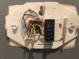 Pull the wires through the thermostat opening and attach the back plate with the provided screws. Why Are The White And Orange Wires Both Connected To My Thermostat S W Terminal Home Improvement Stack Exchange