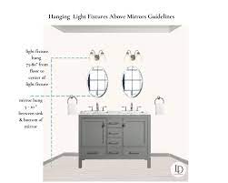 Bought 2 light fixtures to go above the sinks. Guide To Hanging Bathroom Vanity Lighting And Mirrors Liven Design