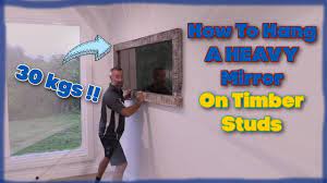 how to hang a heavy mirror on