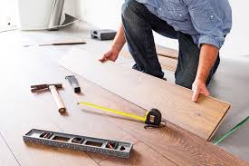 can we install wood flooring over tiles
