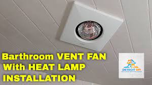 bathroom vent fan with a heat light