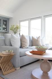 light gray sofa with tan pillows