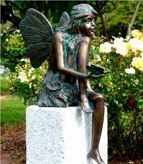 bronze statue fairy sitting with