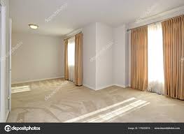 empty sun filled room with carpet floor