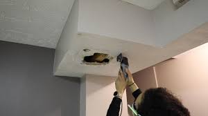 how to repair a large drywall hole in