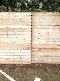 build a wood fence on a chainlink fence