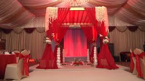 red and gold themed wedding setup