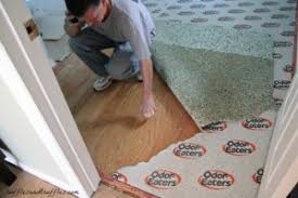 A carpet directly glued down has several bubbles and underneath is a white powder substance. Hardwood Floors Under Carpet Archives Helpful Homemade